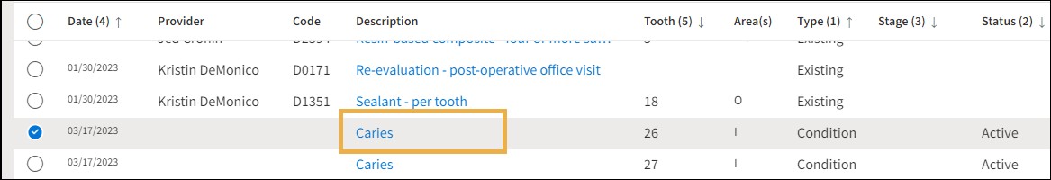 The tooth ledger with a yellow highlight box around the description hyperlink.